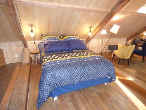 a bedroom with a bed in a attic at Chambres d'hôtes Chez Valérie Garage motos et vélos in Arette