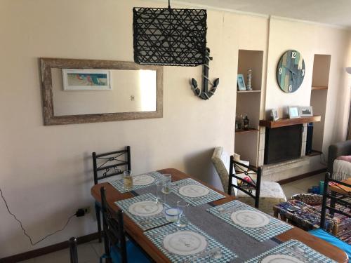 a dining room table with a blue and white table cloth at Maitencillo in Maitencillo