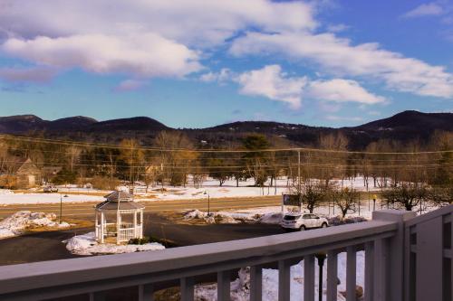a balcony with a car parked in a parking lot at The Lodge at Jackson Village in Jackson