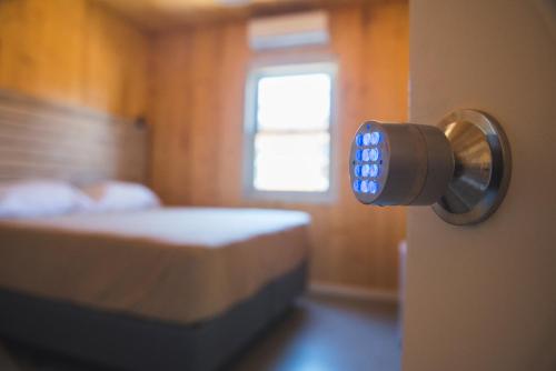 a room with a door knob with a bed at Wanderlust José Ignacio in José Ignacio