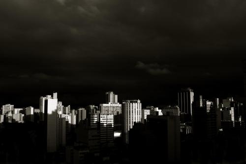 a black and white photo of a city at night at Hotel Brasilia Curitiba in Curitiba
