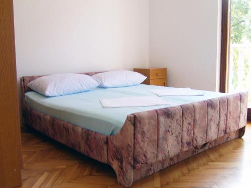 a bed in a room with a faux fur at Apartment in Lopar/Insel Rab 17747 in Lopar