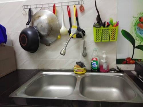 A kitchen or kitchenette at Zah’ra Homestay