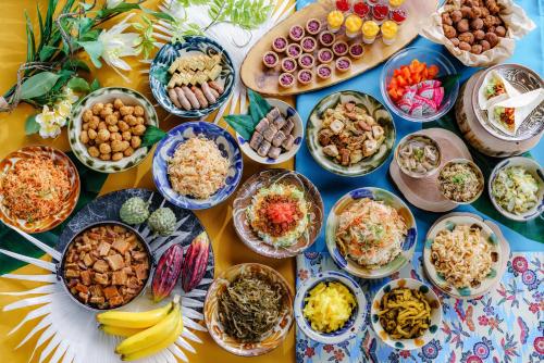 a table full of different types of food at Vessel Hotel Campana Okinawa in Chatan