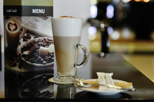 a drink in a glass mug on a table at Carawan Al Fahad Hotel in Riyadh