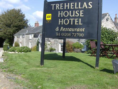 a sign for a hotel in front of a house at Trehellas House Hotel & Courthouse restaurant in Bodmin