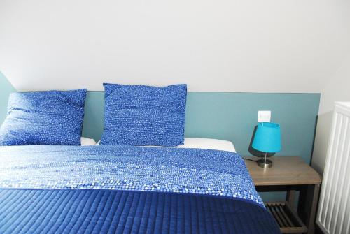 Postel nebo postele na pokoji v ubytování B&B Het Schaliënhof