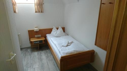 Postel nebo postele na pokoji v ubytování Pension Erbgericht