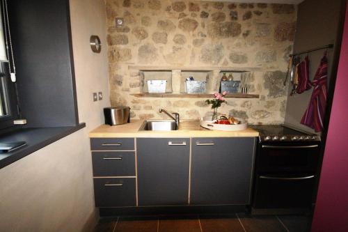Kjøkken eller kjøkkenkrok på L'Oustal du Domaine de Louveraude