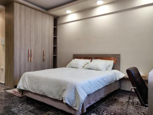 A bed or beds in a room at Agias Sofias Street Luxurious Studio