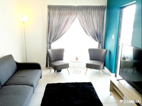 a living room with a couch and two chairs and a window at The Blyde - Crystal Lagoon Penthouse Apartment in Pretoria
