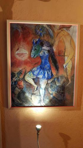 a picture of a woman in a painting on a wall at Stone house on the rock in Lílaia