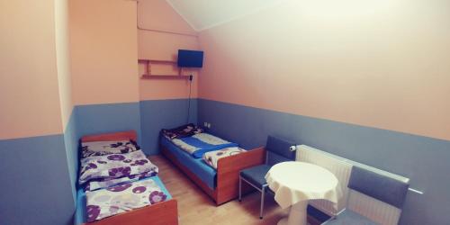 Ένα ή περισσότερα κρεβάτια σε δωμάτιο στο Ośrodek Sportowo Wypoczynkowy PUSTYNIA