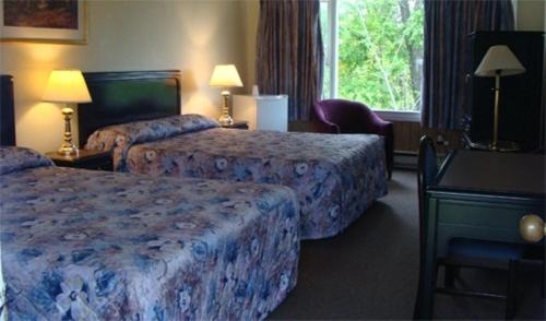 Postel nebo postele na pokoji v ubytování Gateway Motel
