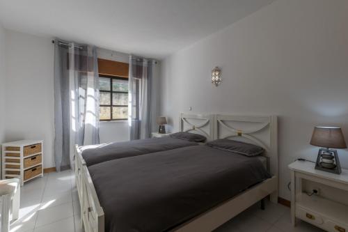 Postel nebo postele na pokoji v ubytování Cardoso Beirao