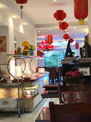 a restaurant with red lanterns and a table and chairs at One-bedroom Apartment near Atomium in Brussels
