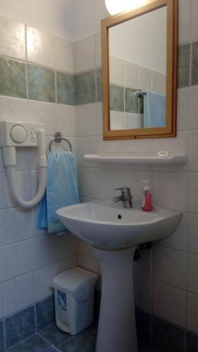 a bathroom with a sink and a mirror at Euktimeno in Vathi, Ithaka