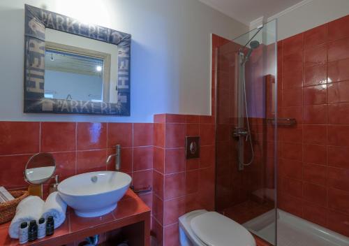 a bathroom with a sink and a shower and a toilet at Amymone and Adiandi in Nafplio