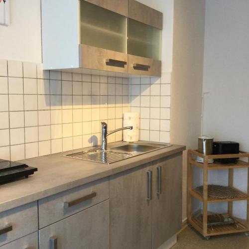a kitchen with a sink and a counter at Appartement 29/1 in Schwäbisch Hall