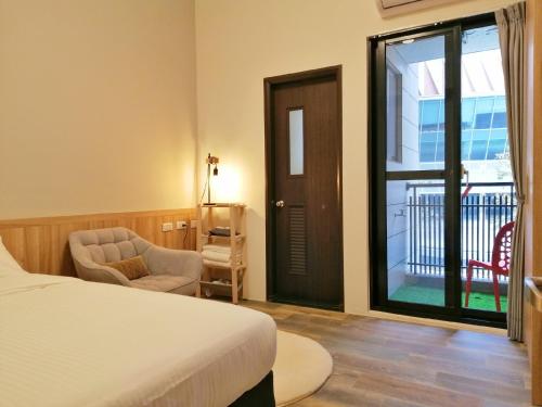 Tempat tidur dalam kamar di See U Tainan Apartment