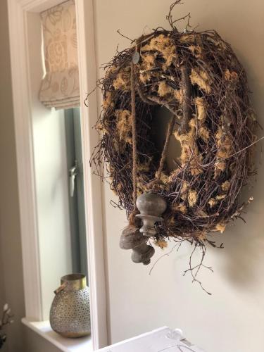 a wreath is hanging on a wall at Beechwood 4, Kenmare Luxurious Living in Killowen