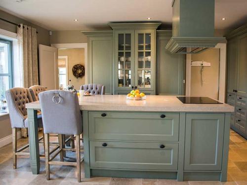 a kitchen with a blue island with a counter top at Beechwood 4, Kenmare - stay for more than 15 days in Killowen