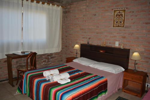 Postel nebo postele na pokoji v ubytování Atahualpa mi Posada