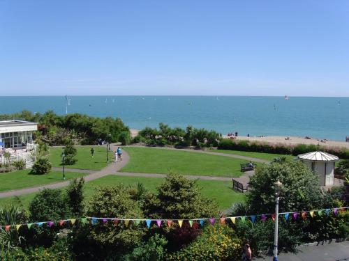 a view of a park with the ocean in the background at Breakers Bed and Breakfast in Eastbourne