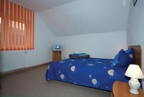 Postel nebo postele na pokoji v ubytování Pension Piatra Craiului