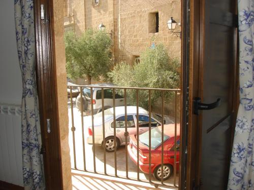 a view of a car parked on a street from a window at Casa Vallés in Adahuesca
