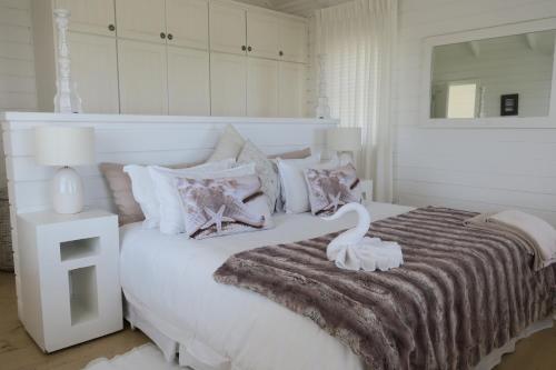 Postel nebo postele na pokoji v ubytování Pearl Bay Beach Home