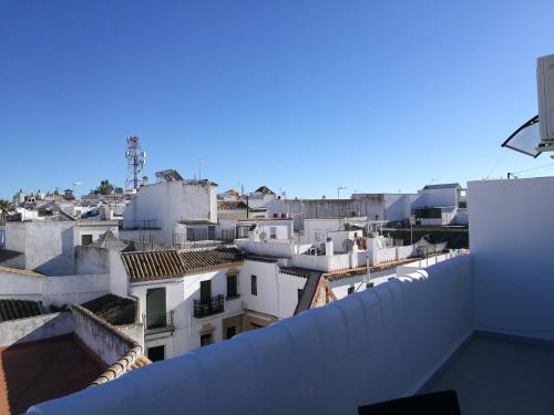 a view of the roofs of buildings in a city at Piso Con Terraza y Vistas Espectaculares in Carmona