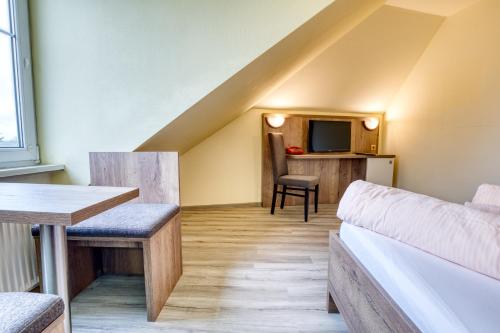 Ένα ή περισσότερα κρεβάτια σε δωμάτιο στο Hotel Kiebitz an der Ostsee