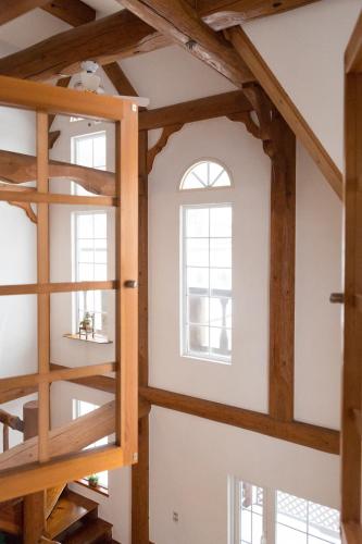 a room with wooden beams and a window at Sapporo Luxury Log House 5Brm max 18ppl 4 free parking in Sapporo