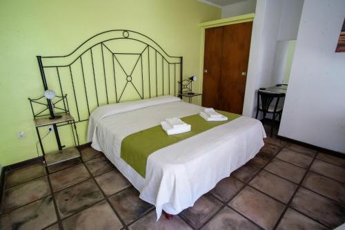 Postel nebo postele na pokoji v ubytování Hotel y Spa Termas del Este