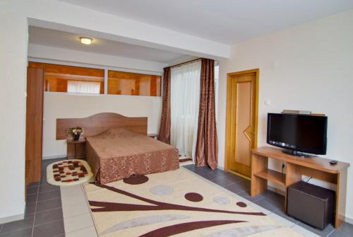 Postel nebo postele na pokoji v ubytování Hotel Tranzzit