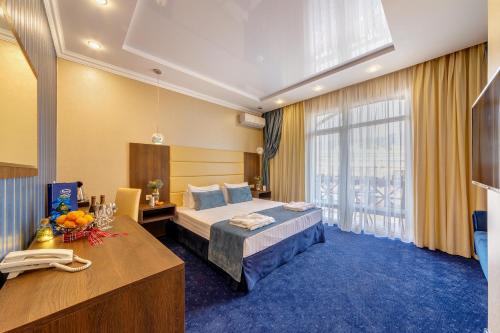 Кровать или кровати в номере Отель Орион 