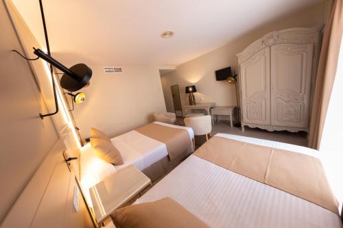 Кровать или кровати в номере Hotel Casablanca