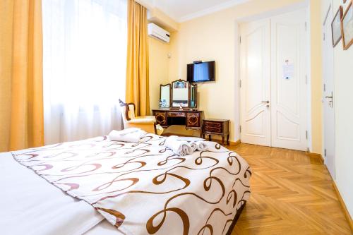 Una cama o camas en una habitación de V Park Hotel