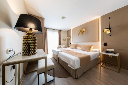 Кровать или кровати в номере Hotel Casablanca