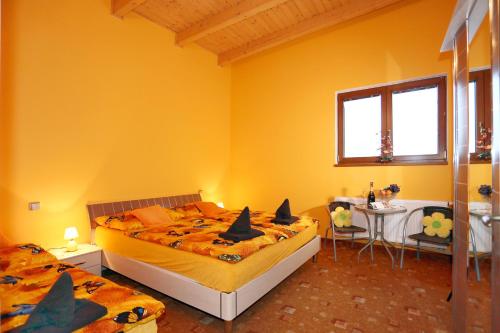 a bedroom with two beds with bats on them at Pension Sunset Mezirolí in Nová Role
