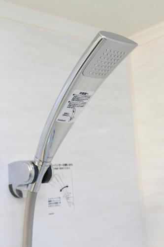 a shower head is attached to a wall at Ginza Capital Hotel Akane in Tokyo