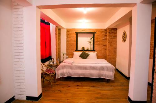 Postel nebo postele na pokoji v ubytování Lumbini Heritage Home