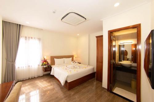 Postel nebo postele na pokoji v ubytování Trường Hải Hotel