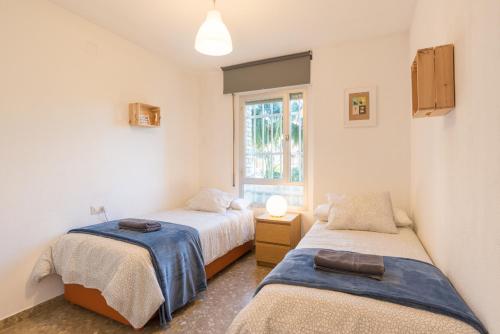 Postel nebo postele na pokoji v ubytování Sweethome El Palo