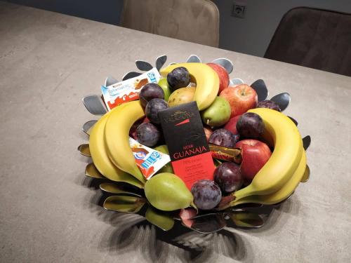 a bunch of fruit in a bowl on a table at Athenian Residences in Athens
