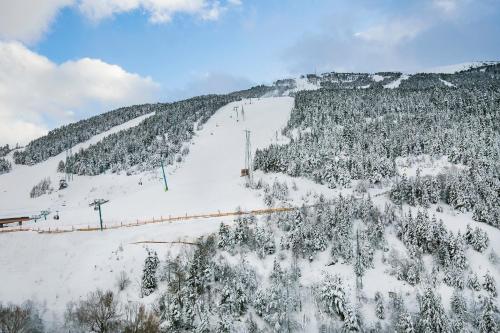 a snow covered mountain with a ski lift at Hotel Piolets Soldeu Centre by Nexta in Soldeu