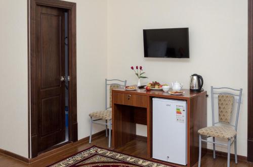 Η κουζίνα ή μικρή κουζίνα στο Karakalpak Palace Hotel