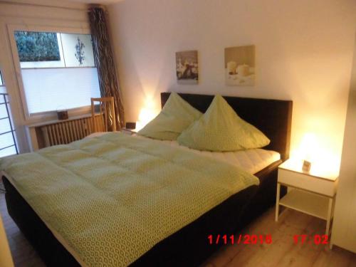 a bedroom with a bed and a window at Ferienwohnung Jesper in Braunlage
