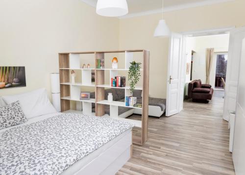 a bedroom with a bed and a book shelf at Scheinerhaus in Laa an der Thaya
